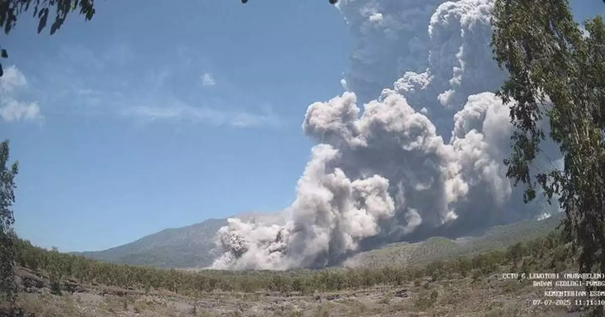 Residents wear masks as volcanic ash blankets villages near erupting Indonesian volcano