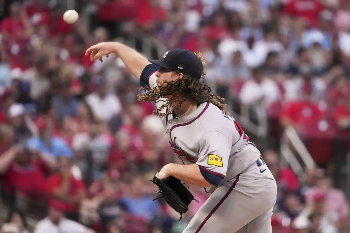 Atlanta Braves starting pitcher Grant Holmes throws during the first inning of a baseball game against the St. Louis Cardinals Friday, July 11, 2025, in St. Louis. (AP Photo/Jeff Roberson)