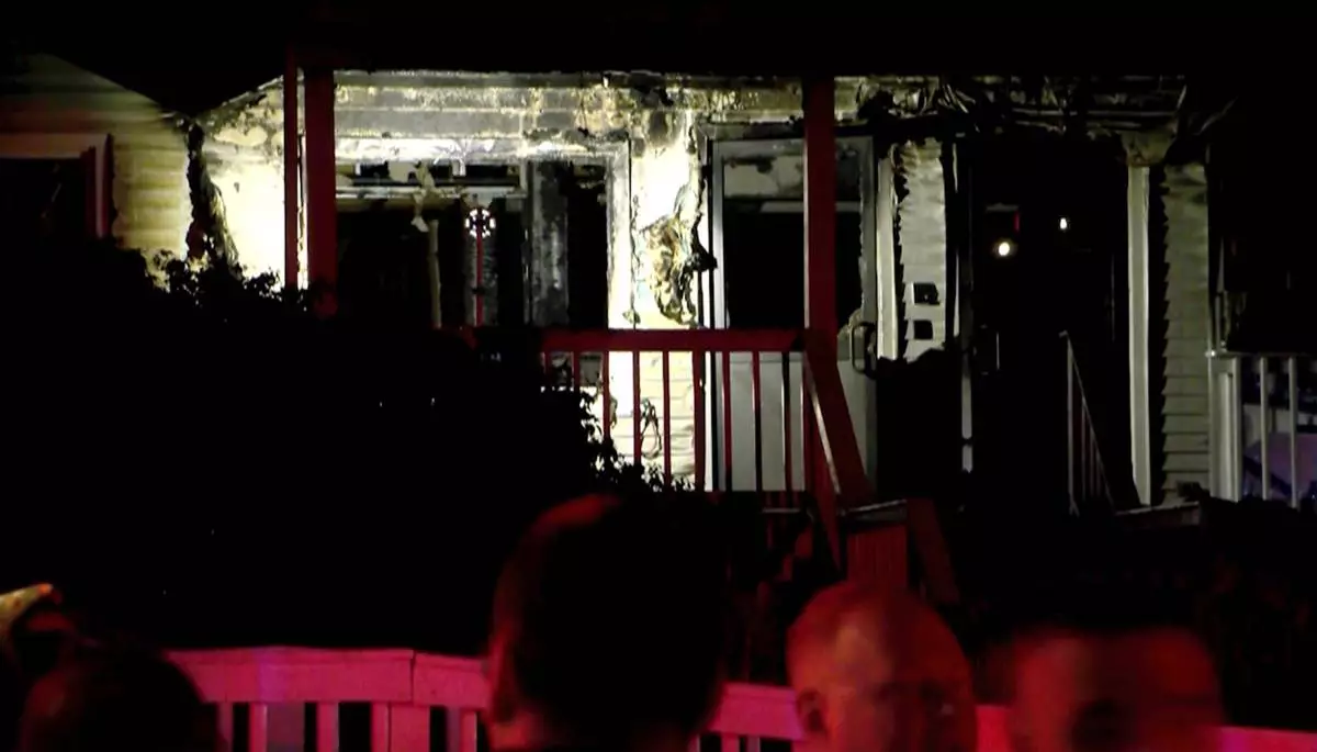 This image taken from video provided by WLNE-TV shows authorities working on the scene of a fire at an assisted living facility in Fall River, Mass., Sunday, July 13, 2025. (WLNE-TV via AP)