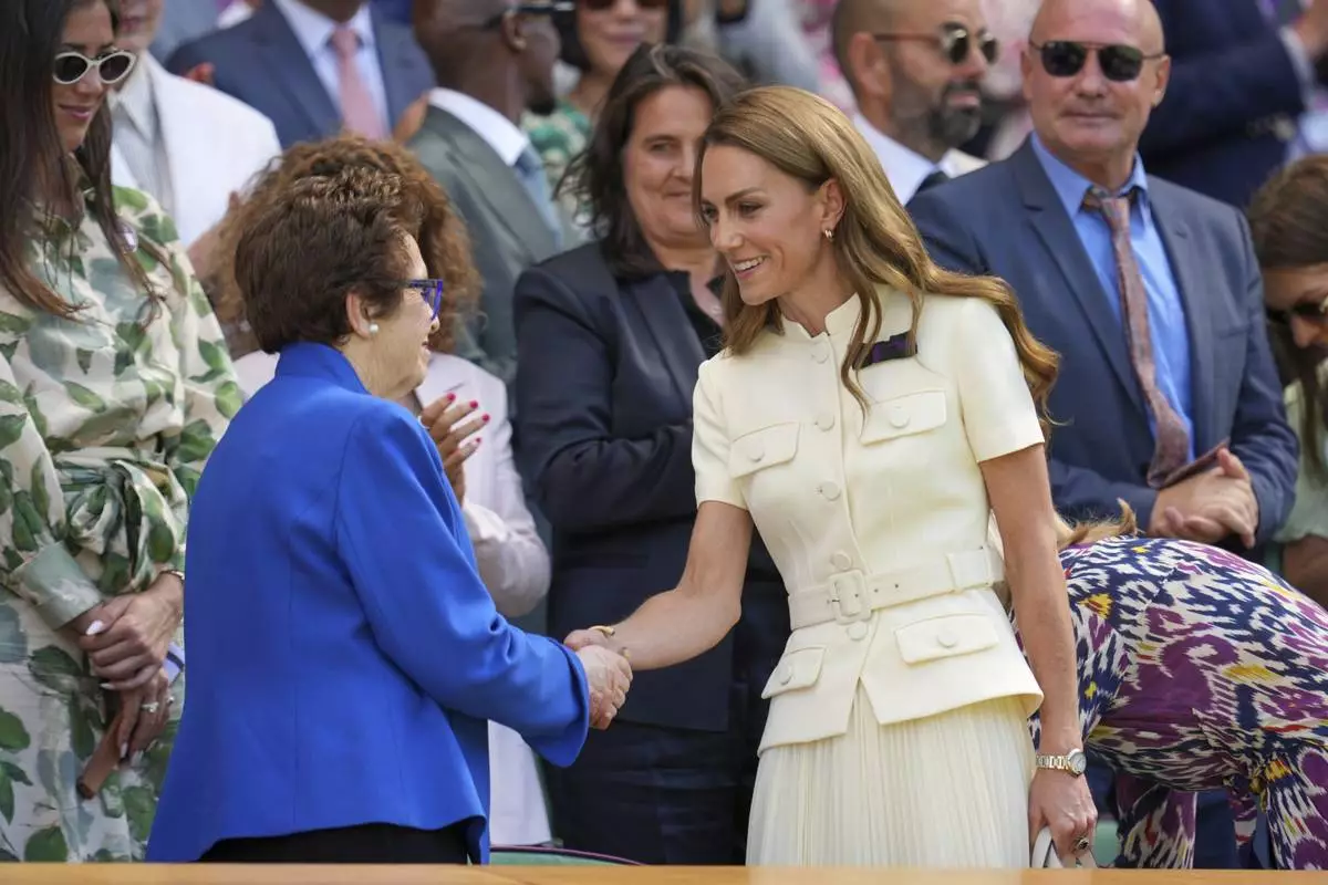 Britain's Kate, Princess of Wales shakes hands with tennis legend Billie Jean King in the Royal Box on Centre Court ahead of the women's singles final at the Wimbledon Tennis Championships in London, Saturday, July 12, 2025. (AP Photo/Kin Cheung)