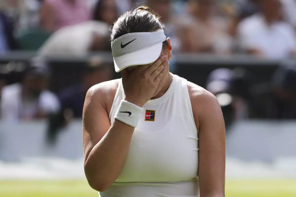Amanda Anisimova of the U.S. reacts during the women's singles final match against Iga Swiatek of Poland at the Wimbledon Tennis Championships in London, Saturday, July 12, 2025.(AP Photo/Kirsty Wigglesworth)