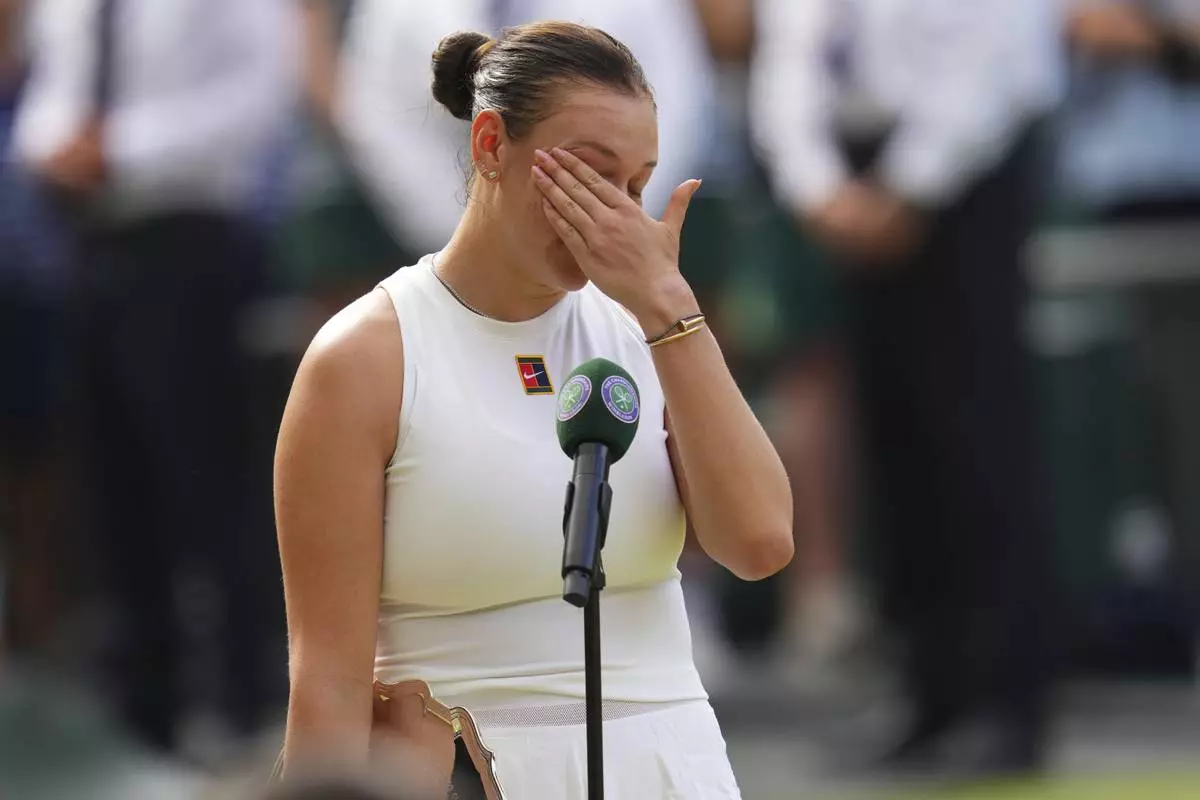 Amanda Anisimova of the U.S. reacts after losing the women's singles final match against Iga Swiatek of Poland at the Wimbledon Tennis Championships in London, Saturday, July 12, 2025.(AP Photo/Kirsty Wigglesworth)