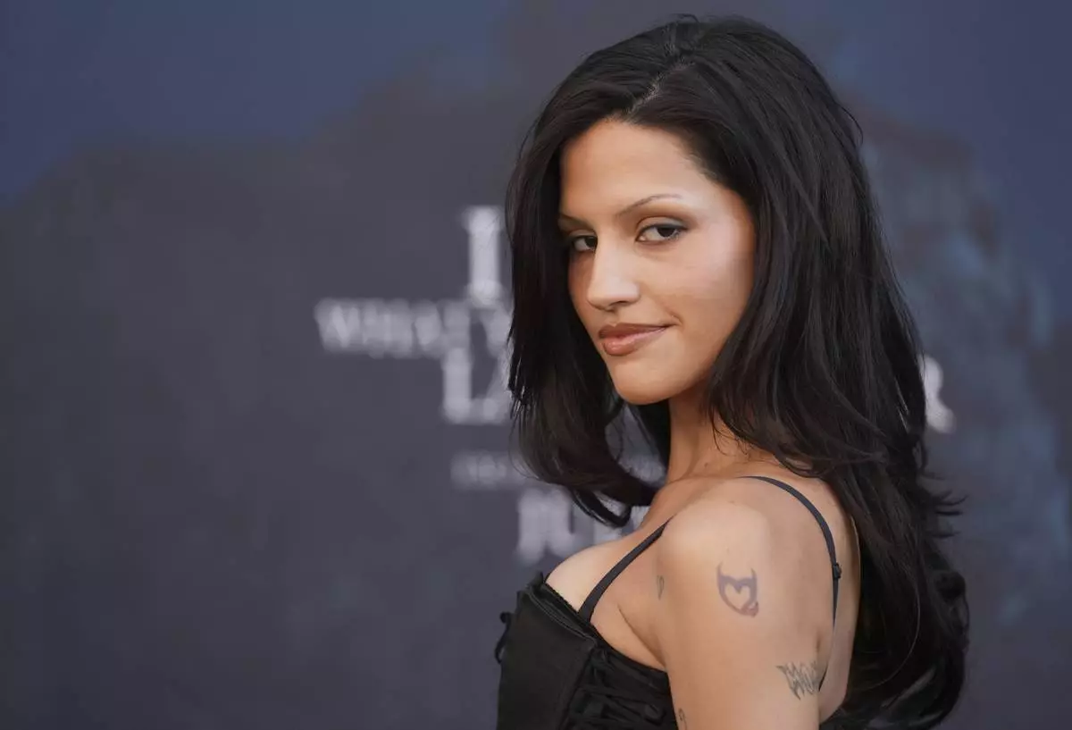 Gabbriette Bechtel, a cast member in "I Know What You Did Last Summer," poses at the premiere of the film at The United Theater on Broadway, Monday, July 14, 2025, in Los Angeles (AP Photo/Chris Pizzello)