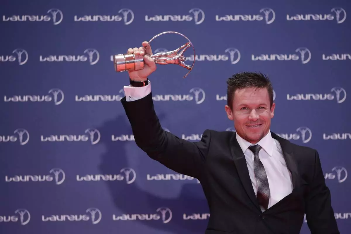 FILE - Austria skydiver Felix Baumgartner holds the Laureus World Action Sportsperson trophy as he poses for pictures during the Year at the Laureus World Sports Awards in Rio de Janeiro, Brazil, March 11, 2013. (AP Photo/Felipe Dana, File)