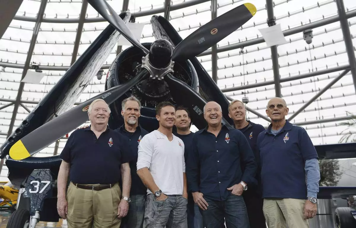 FILE - The Red Bull Stratos team from left: Col. Joe Kittinger, Art Thompson, Felix Baumgartner, Luke Aikins, Andy Walsh, Jon Clark and Mike Todd pose for photographers after a press conference in Salzburg, Austria, Oct. 27, 2012. (AP Photo/Kerstin Joensson, File)