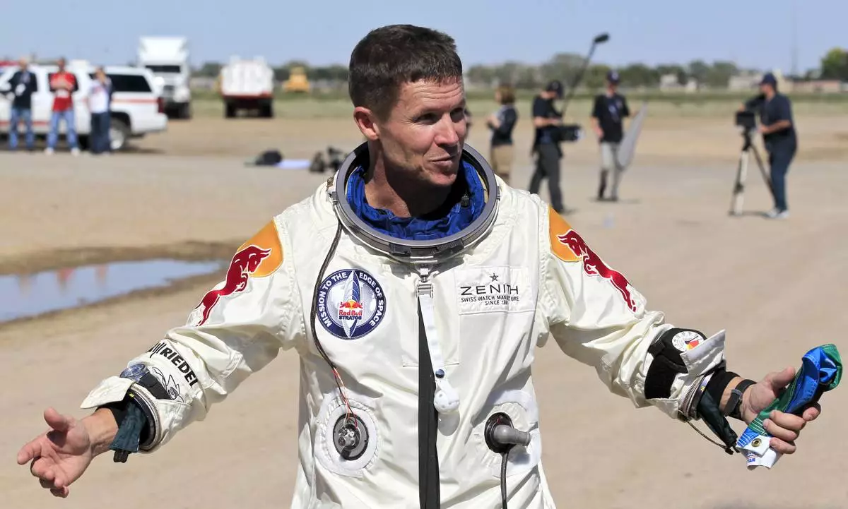 FILE - Felix Baumgartner of Austria gestures prior to speaking with the media after successfully jumping from a space capsule lifted by a helium balloon in Roswell, N.M., Oct. 14, 2012. (AP Photo/Ross D. Franklin, File)