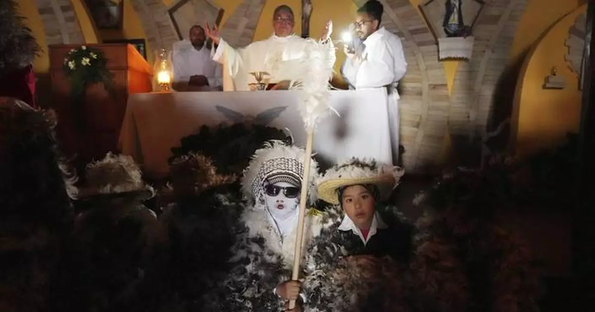 Despite rainy weather, Catholics in a Paraguayan town dress as birds to honor their patron saint