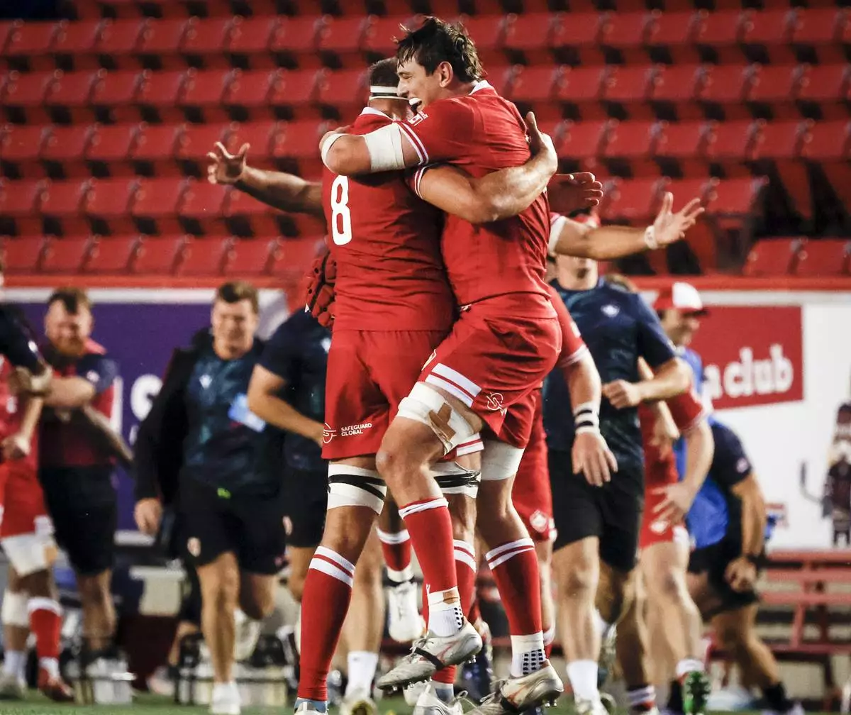 Canada's Tyler Ardron, left, and Piers Von Dadelszen, right, celebrate after defeating the United States in Pacific Nations Cup rugby match action in Calgary, Alberta, Friday, Aug. 22, 2025. (Jeff McIntosh/The Canadian Press via AP)