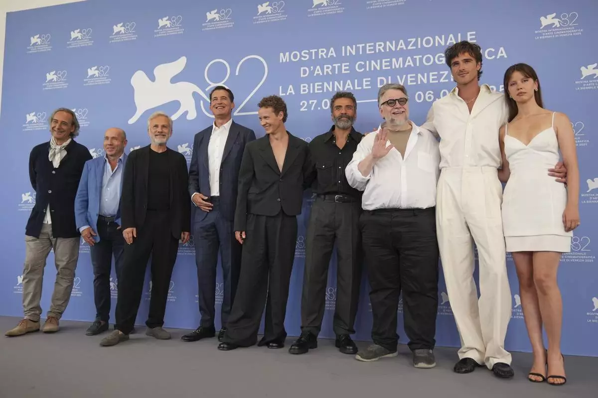 Composer Alexandre Desplat, from left, producer J. Miles Dale, Christoph Waltz, producer Scott Stuber, Felix Kammerer, Oscar Isaac, director Guillermo del Toro, Jacob Elordi and Mia Goth pose for photographers at the photo call for the film 'Frankenstein' during the 82nd edition of the Venice Film Festival in Venice, Italy, on Saturday, Aug. 30, 2025. (Photo by Alessandra Tarantino/Invision/AP)