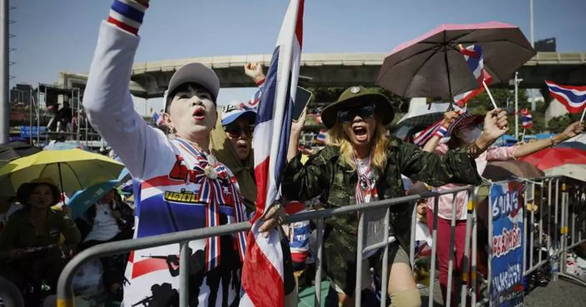 Protesters in Bangkok demand resignation of court-suspended prime minister following deadly conflict