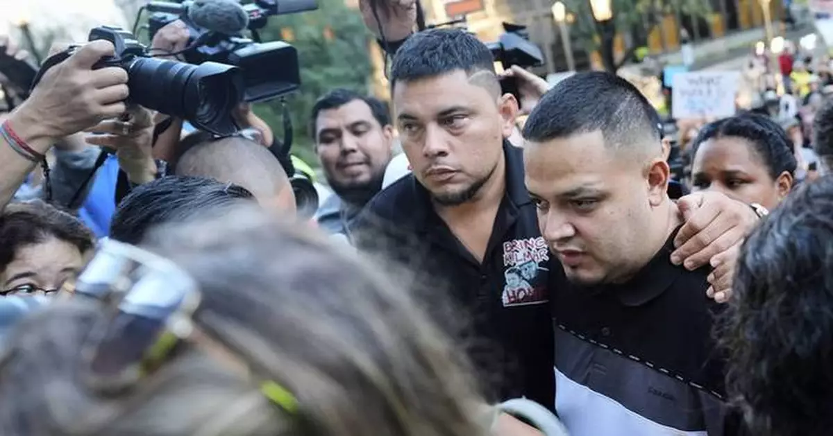 Photos of Abrego Garcia turning himself in at ICE office surrounded by family and supporters