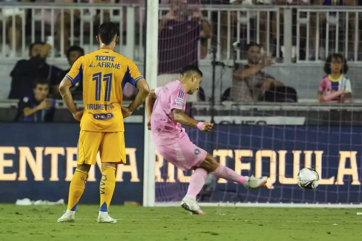 Inter Miami forward Luis Suárez kicks a penalty for a goal during the first half of a Leagues Cup quarterfinal soccer match against Tigres UANL, Wednesday, Aug. 20, 2025, in Fort Lauderdale, Fla. (AP Photo/Lynne Sladky)