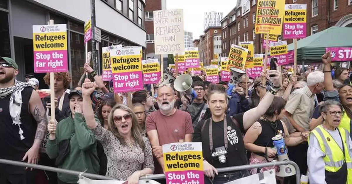 Rival anti-migrant and anti-racism protests face off outside a hotel housing migrants in London