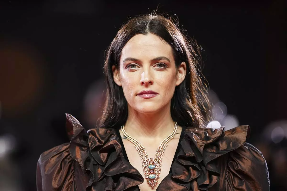 Riley Keough poses for photographers at the red carpet for the film 'Jay Kelly' during the 82nd edition of the Venice Film Festival in Venice, Italy, on Thursday, Aug. 28, 2025. (Photo by Scott A Garfitt/Invision/AP)