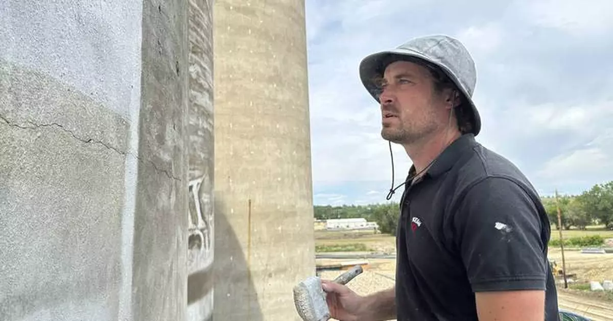 An Australian artist is painting huge murals on silos in the US Midwest