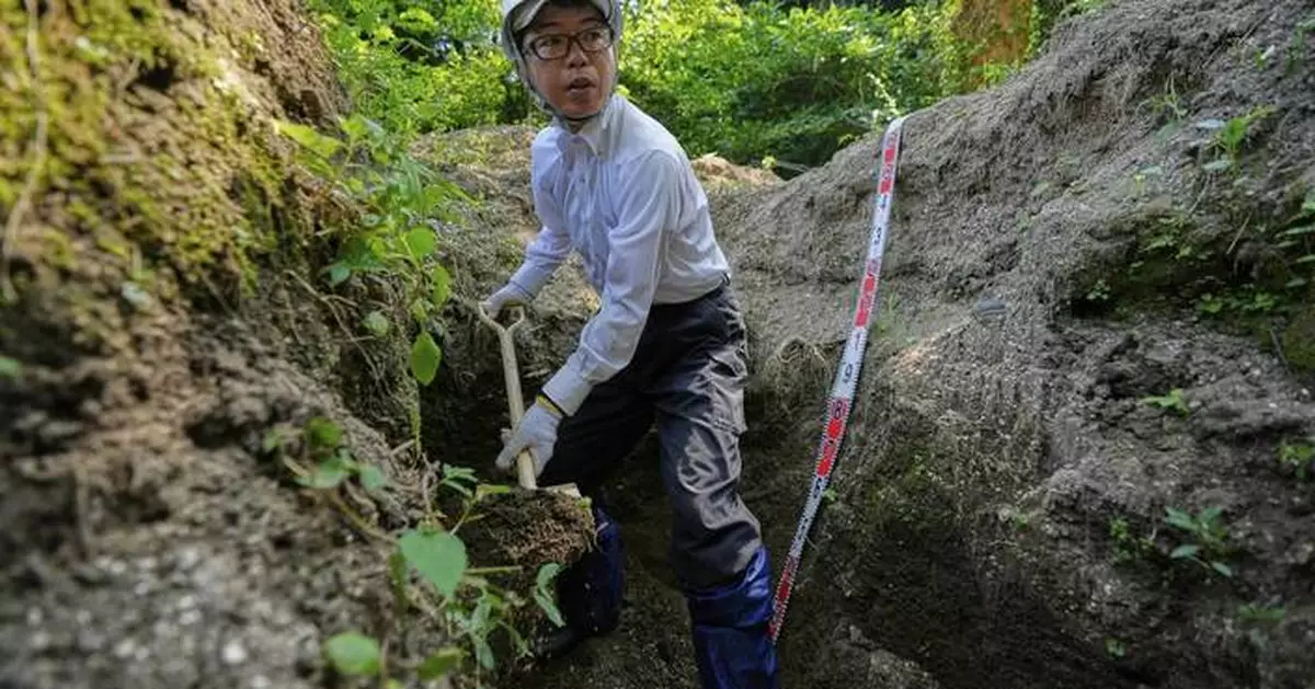 Photos of searchers seeking victims of a Hiroshima bombing 80 years later on a nearby island