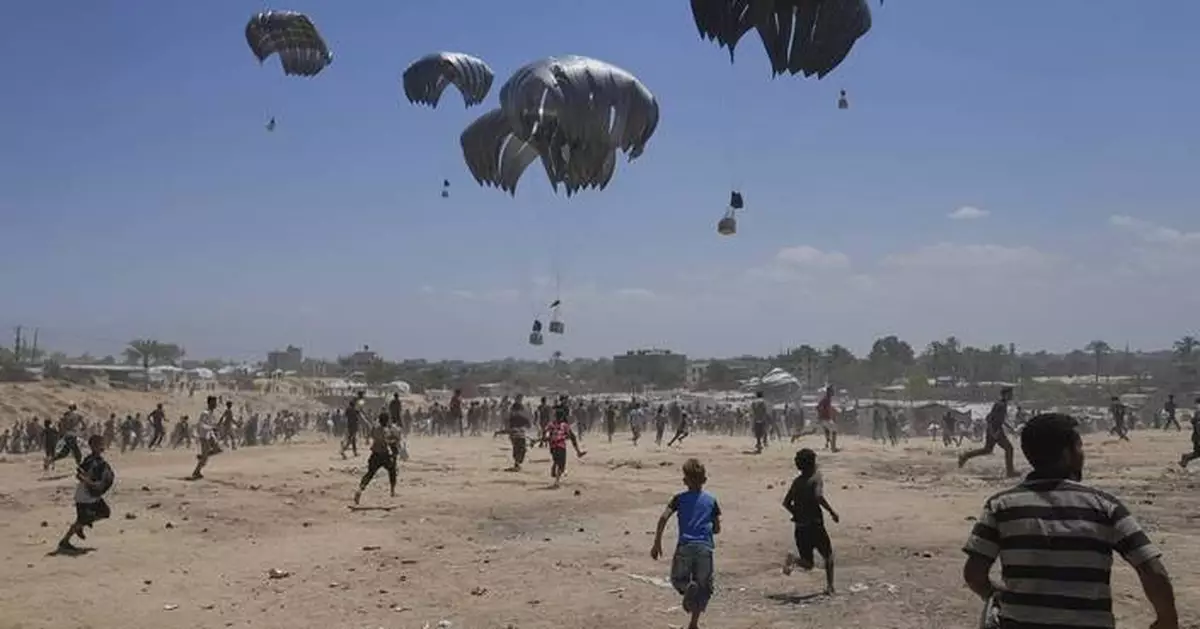 Photos show Palestinians pursuing food aid after the latest air drops in Gaza