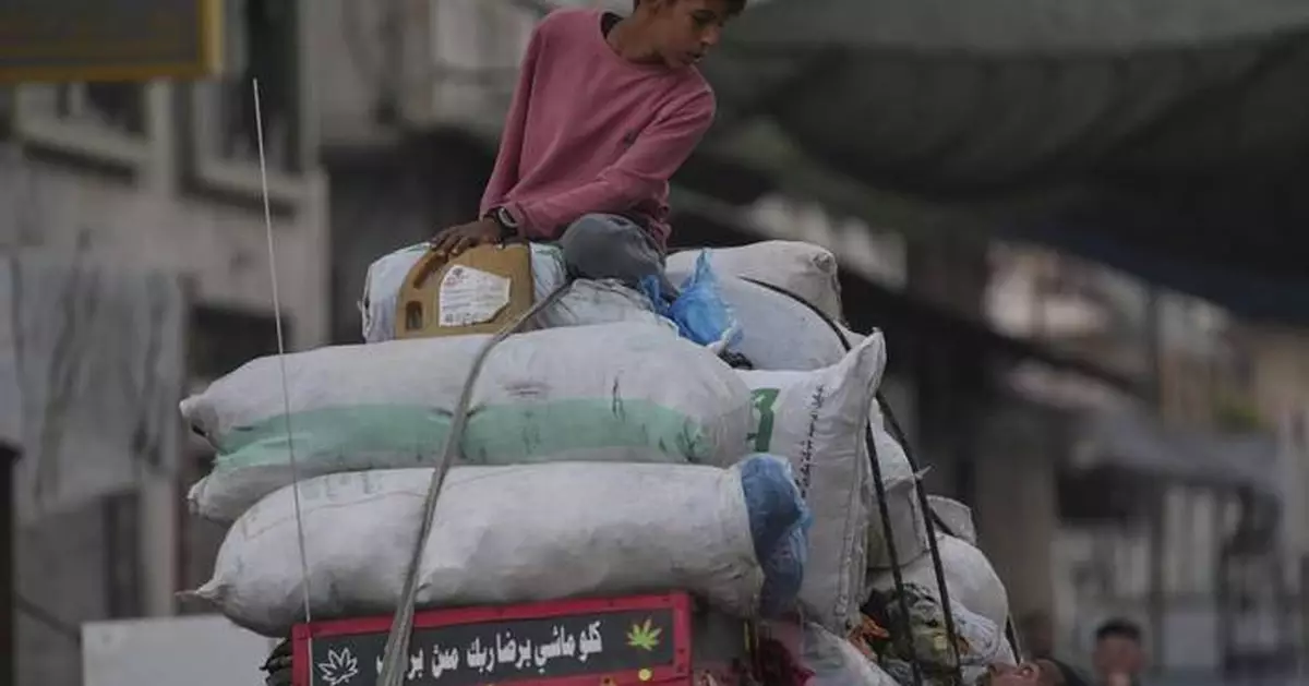 Photos show displaced Palestinians fleeing the northern Gaza Strip