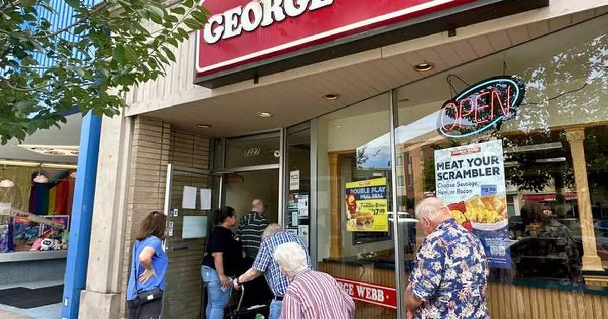 Brewers fans line up to grab free burgers as part of local fast-food chain's promotion
