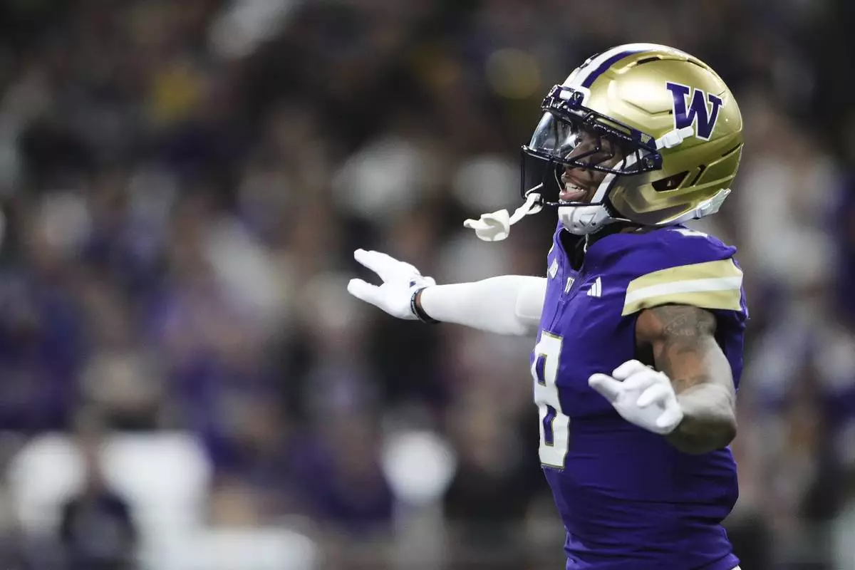 Washington cornerback Tacario Davis reacts during the first half of an NCAA college football game against Colorado State, Saturday, Aug. 30, 2025, in Seattle. (AP Photo/Lindsey Wasson)