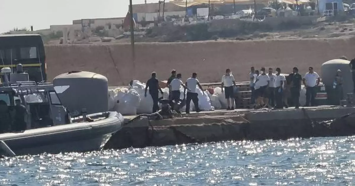 A boat carrying migrants capsizes off Italy, killing at least 26