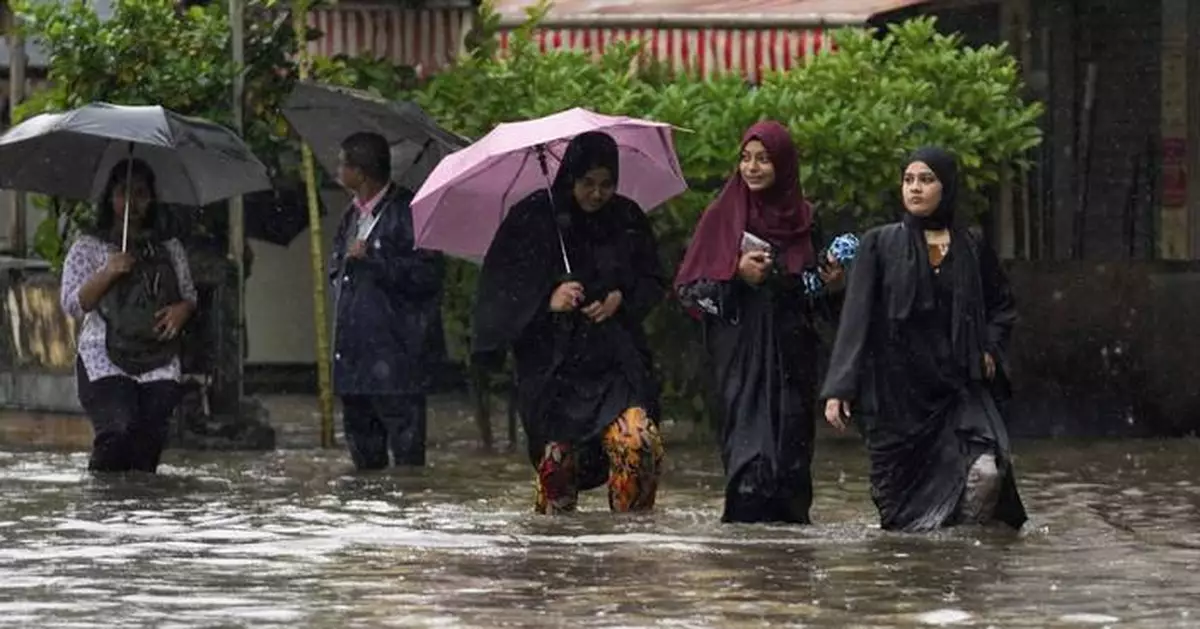 Record rains bring Mumbai to a standstill, in photos