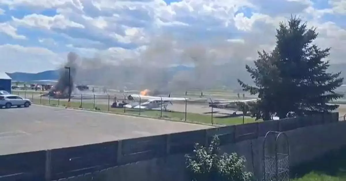 Plane crashes into parked aircraft while landing at Montana airport, sparking fire