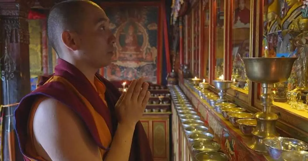 Young lama exploring way to serve people with Buddhism