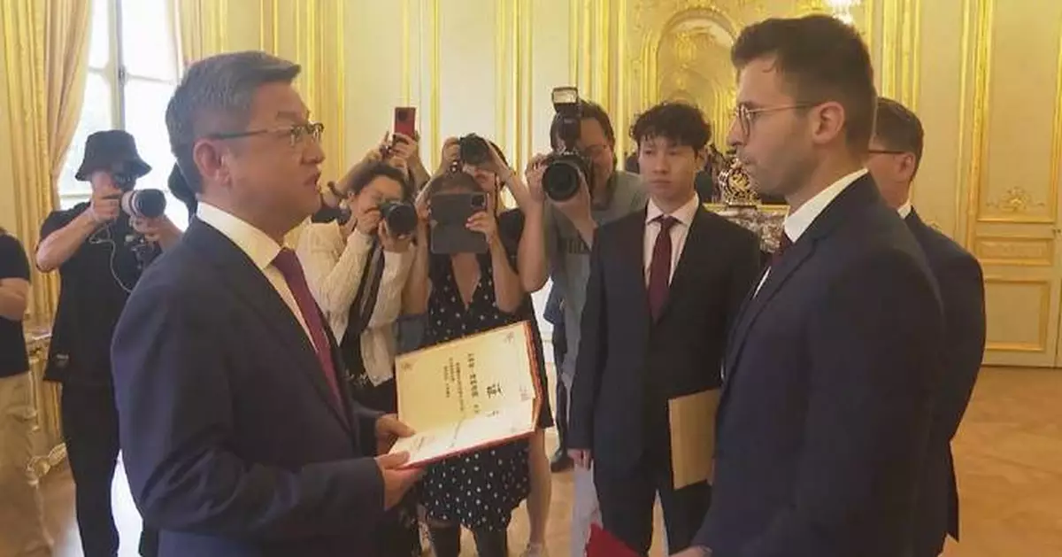 Chinese Embassy in France holds ceremony for handover of historical Songhu Battle photos