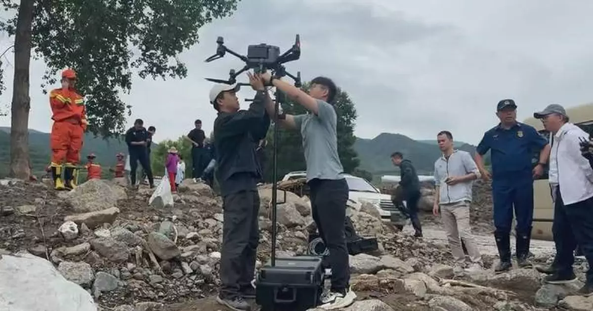 Rescuers use high-tech devices to search for missing people in flood-hit Gansu