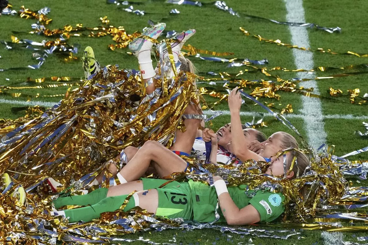England's players celebrate winning the Women's Euro 2025 final soccer match between England and Spain at St. Jakob-Park in Basel, Switzerland, July 27, 2025. (AP Photo/Michael Probst)