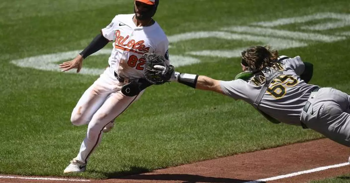 Willie MacIver hits a 2-run double in the 9th to rally Athletics over Orioles