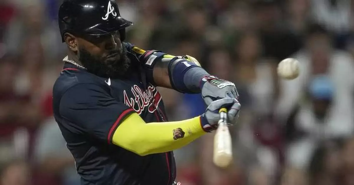 Ozuna's sacrifice fly in 10th gives Braves 12-11 win over Reds