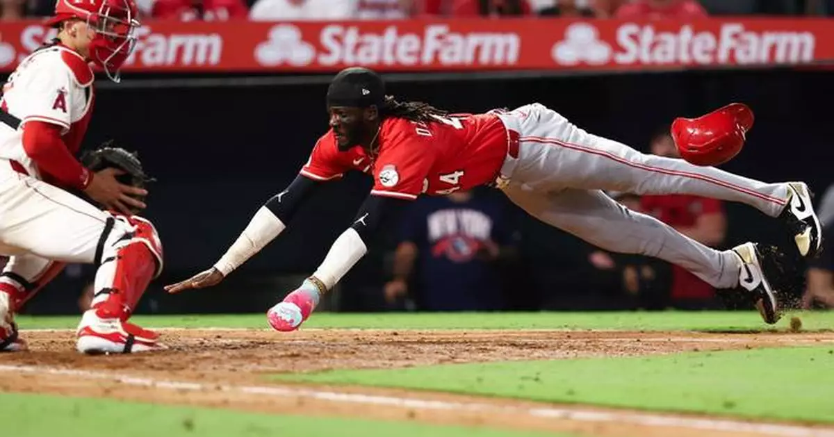 Lux hits 2-run homer and Singer pitches triple-happy Reds to 4-1 win over Angels