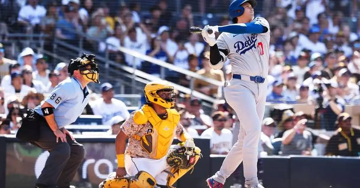 Shohei Ohtani high-fives a heckler after his homer to cap Dodgers' comeback rivalry win over Padres