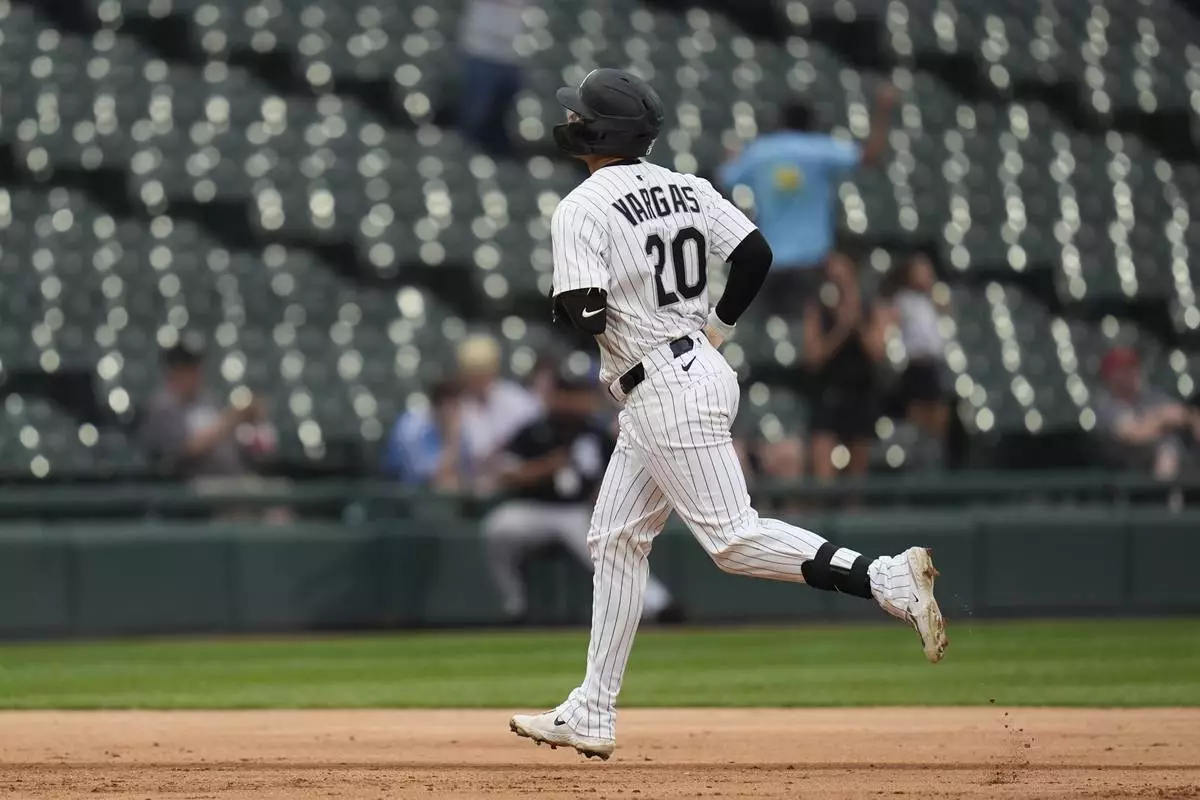 CORRECTS INNING - Chicago White Sox's Miguel Vargas (20) runs the bases after hitting a three-run home run during the seventh inning of a baseball game against the Philadelphia Phillies, Wednesday, July 30, 2025, in Chicago. (AP Photo/Erin Hooley)