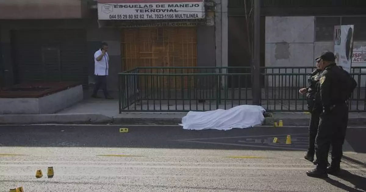 Mexico City mayor says police have arrested 13 in connection with killings of her staffers