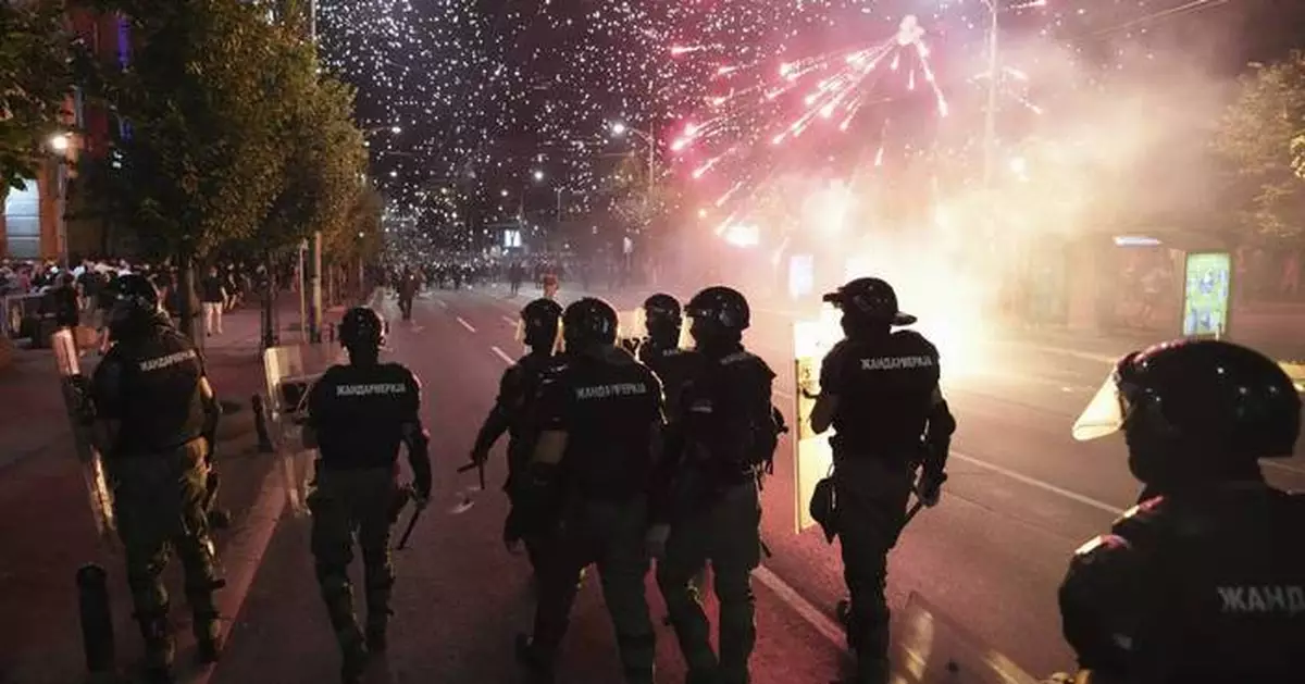 Serbia's police fire tear gas as they clash with anti-government protesters in downtown Belgrade