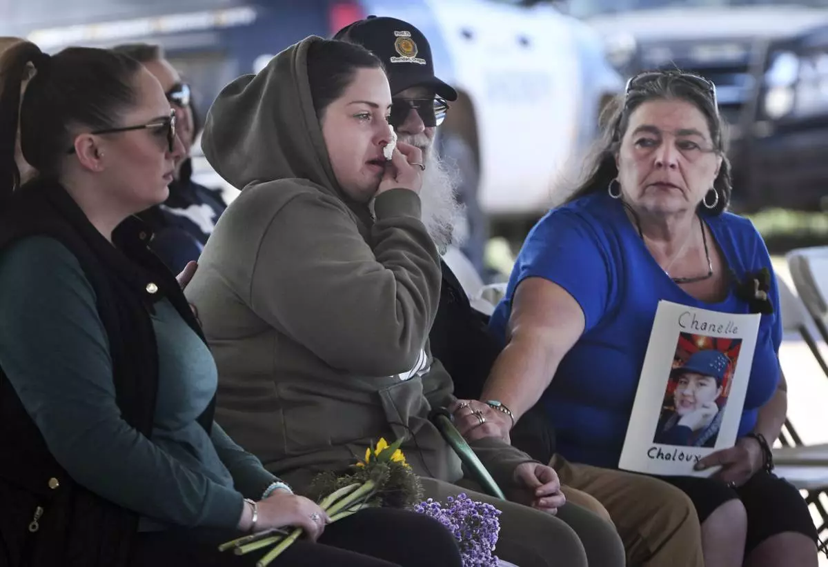 Angelika Steadman, right, reaches over to comfort Samantha Naranjo, whose grandmother Dorothy Tardif, was among the bodies found at the Return to Nature Funeral Home and Steadman's daughter, Chanelle Chaloux, has yet to be found, during a small ceremony before the start of demolition of the funeral home in Penrose, Colo., Tuesday, March 15, 2024. (Jerilee Bennett/The Gazette via AP, File)
