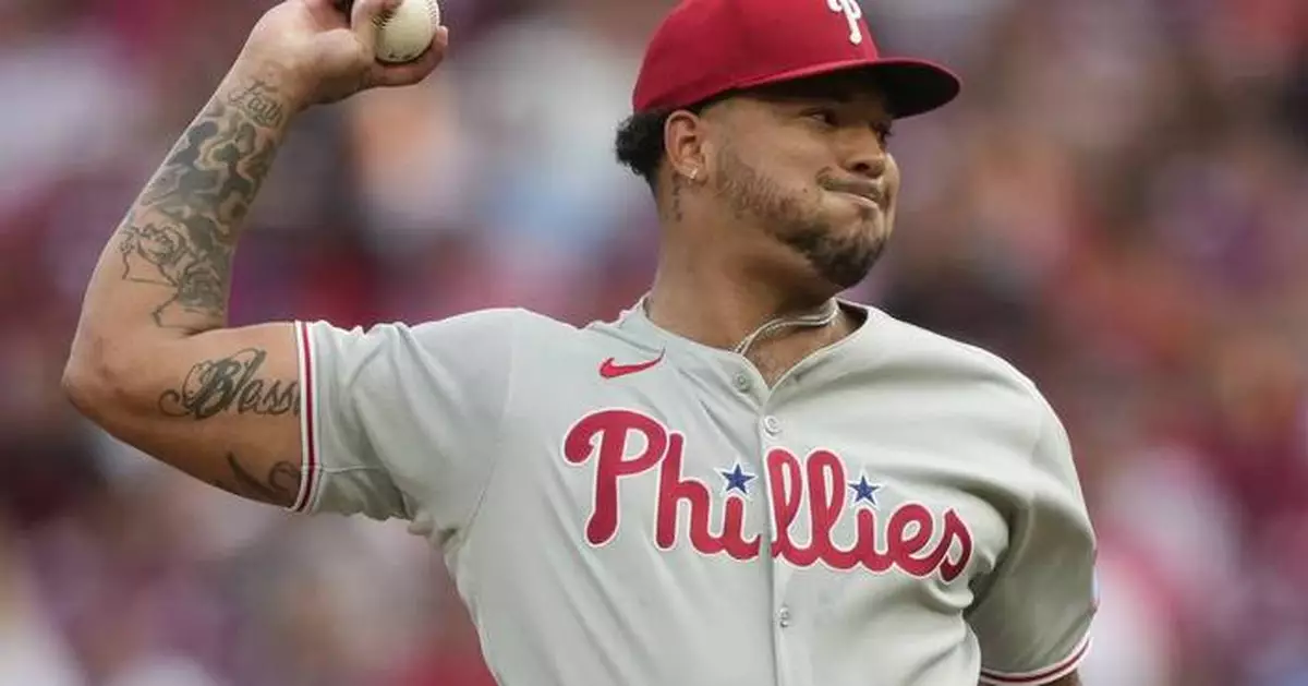 Schwarber hits his 42nd homer in a 4-run 8th inning as the Phillies rally past the Reds