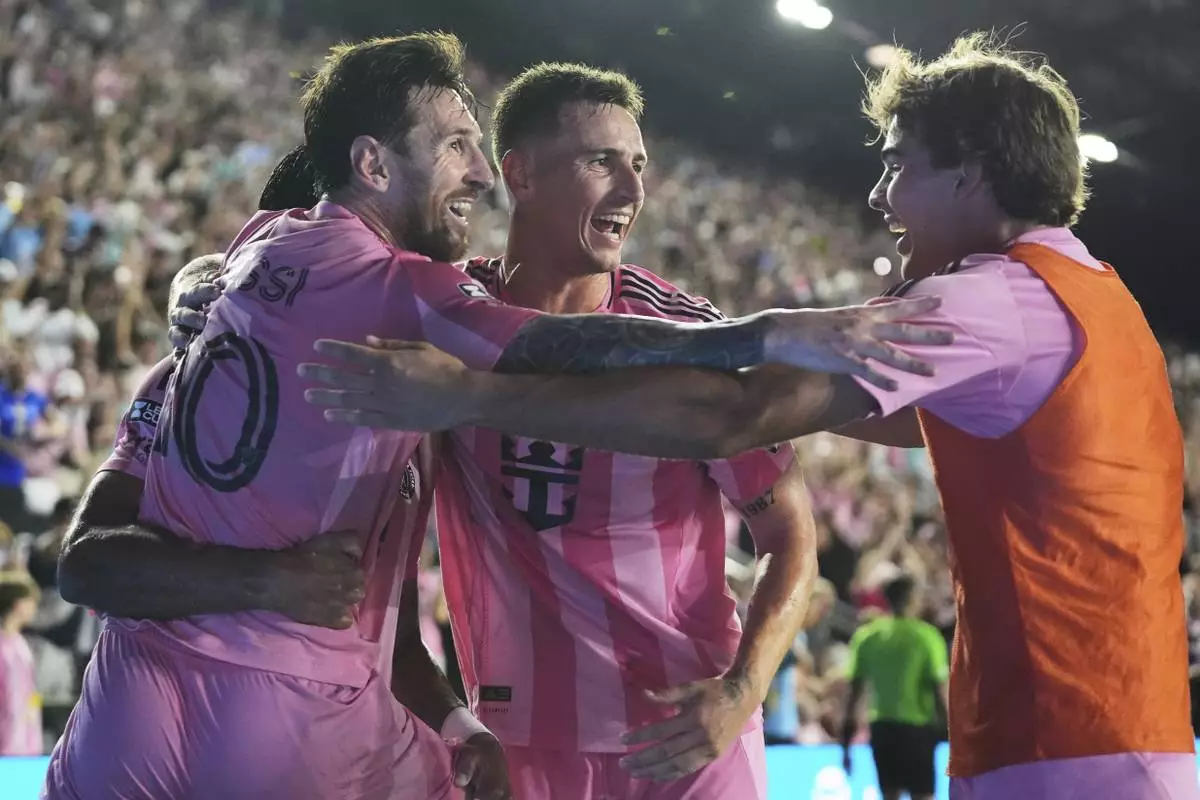 Inter Miami forward Lionel Messi (10) celebrates with his teammates after Telasco Segovia, not shown, scored a goal during the second half of a Leagues Cup semifinal soccer match against Orlando City, Wednesday, Aug. 27, 2025, in Fort Lauderdale, Fla. (AP Photo/Lynne Sladky)