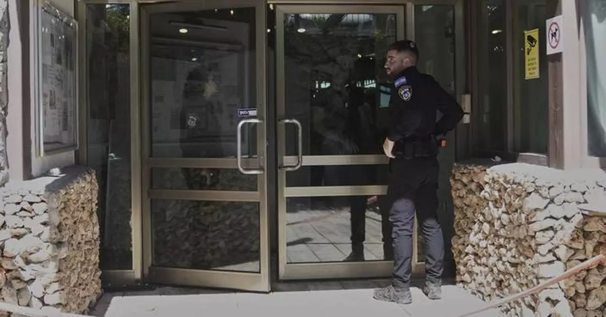 2 people are stabbed at a hotel outside Jerusalem. Israeli police say it's a militant attack