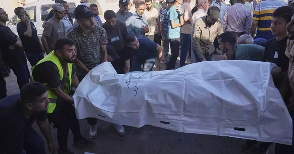 Strikes across Gaza kill at least 31 as international scholars accuse Israel of genocide