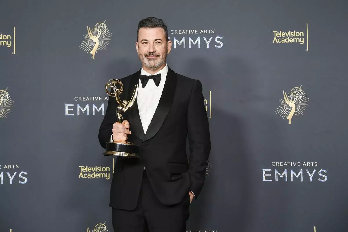 Jimmy Kimmel poses in the press room with the award for host for a game show for "Who Wants to Be a Millionaire" during night two of the Creative Arts Emmy Awards on Sunday, Sept. 7, 2025, at the Peacock Theater in Los Angeles. (Photo by Richard Shotwell/Invision/AP)