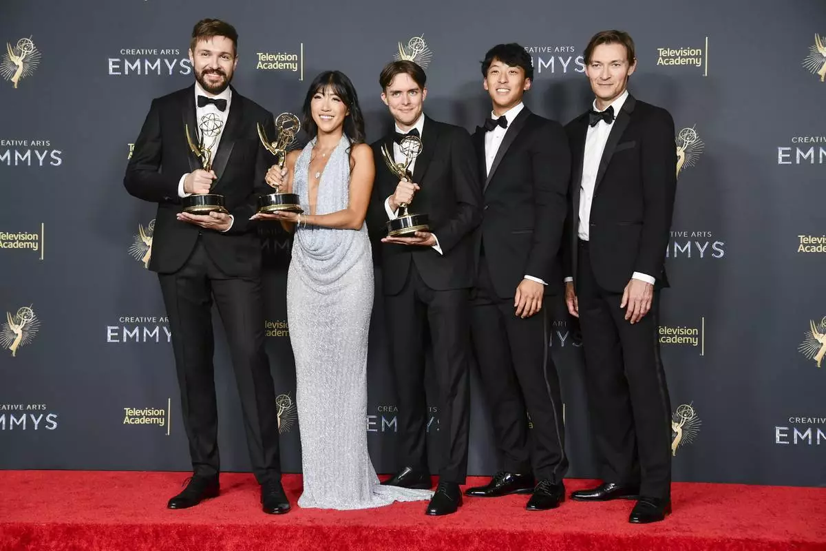 The team from "White Rabbit" pose in the press room with the award for outstanding innovation in emerging media programming during night two of the Creative Arts Emmy Awards on Sunday, Sept. 7, 2025, at the Peacock Theater in Los Angeles. (Photo by Richard Shotwell/Invision/AP)