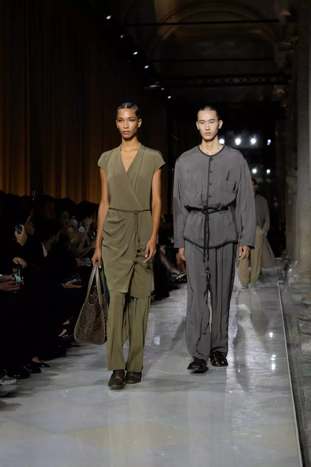 Models wear creations as part of the Giorgio Armani Spring/Summer 2026 collection show in Milan, Italy, Sunday, Sept. 28, 2025. (AP Photo/Luca Bruno)