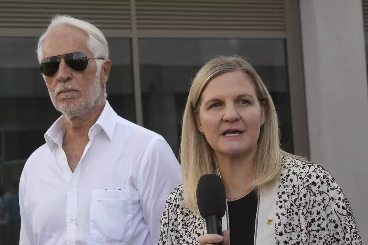 IOC President Kirsty Coventry, right, and Milano Cortina 2026 Foundation President Giovanni Malago visit the Olympic and Paralympic Village in Milan, Italy, Thursday, Sept. 18, 2025. (AP Photo/Antonio Calanni)