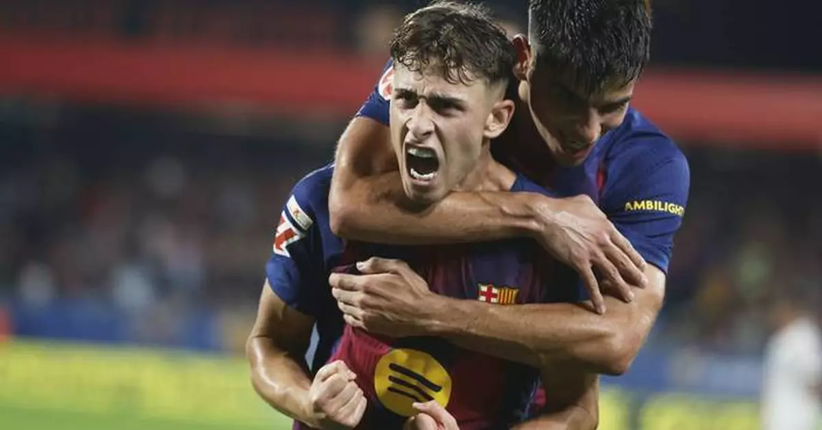 Barcelona routs Valencia 6-0 with goals from Raphinha, Lewandowski and López