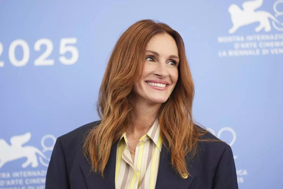 Julia Roberts poses for photographers at the photo call for the film 'After the Hunt' during the 82nd edition of the Venice Film Festival in Venice, Italy, on Friday, Aug. 29, 2025. (Photo by Scott A Garfitt/Invision/AP)