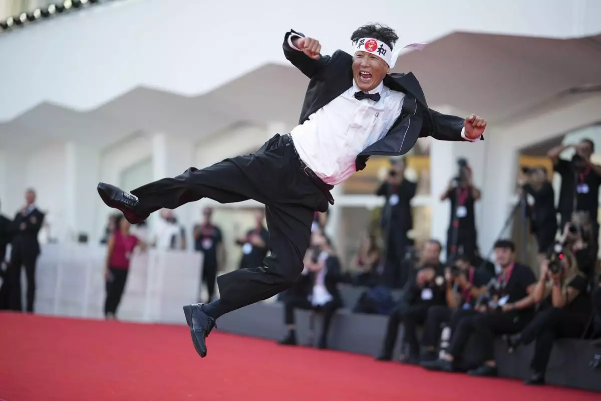 Daisuke Tarutani poses for photographers on the red carpet for the film 'The Sun Rises on Us All' during the 82nd edition of the Venice Film Festival in Venice, Italy, on Friday, Sept. 5, 2025. (Photo by Alessandra Tarantino/Invision/AP)